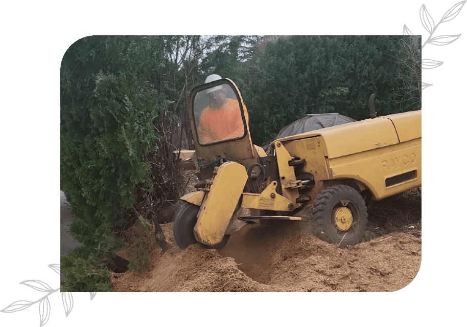 A yellow truck is driving through the dirt.